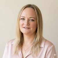 Portrait photo of Cheska. She has long blonde hair and is facing the camera, smiling.